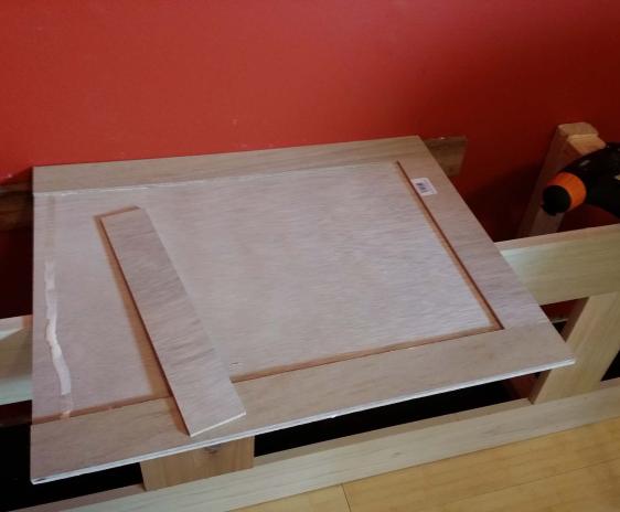 Gluing trim to the door panel.